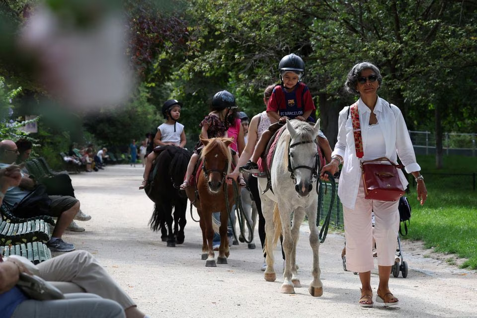 Children take a pony ride on the Parc Monceau as the city of Paris is introducing a ban on pony-riding starting from 2025 after the animal protection association, Paris Animaux Zoopolis warned of shortcomings in animal welfare in Paris, France, August 16, 2023. Photo: Reuters