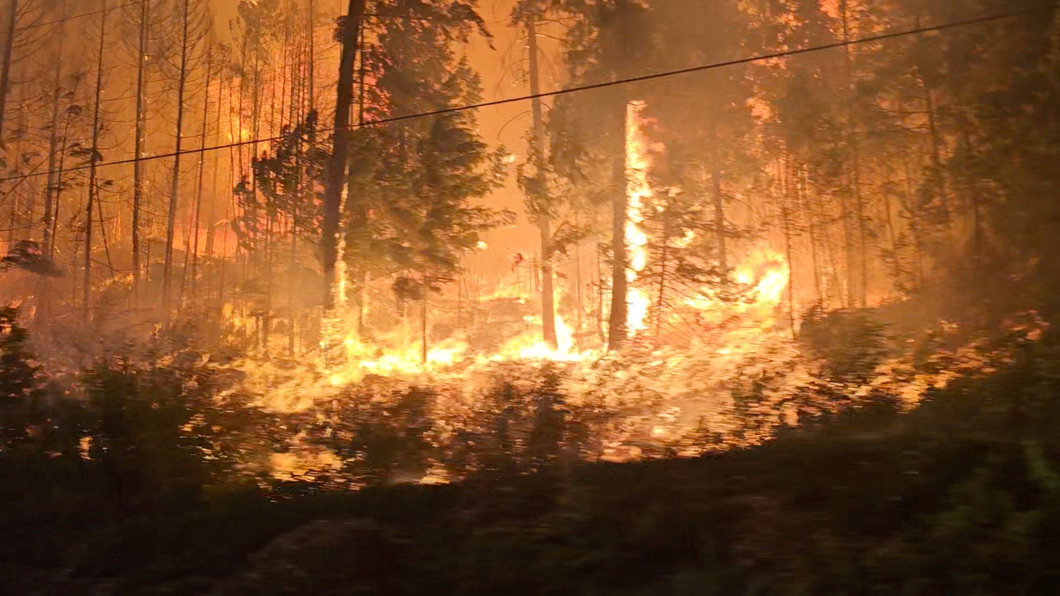 A view of fire close to highway near Sorrento, British Columbia, Canada, August 18, 2023 in this screen grab obtained from social media video. Photo: Reuters