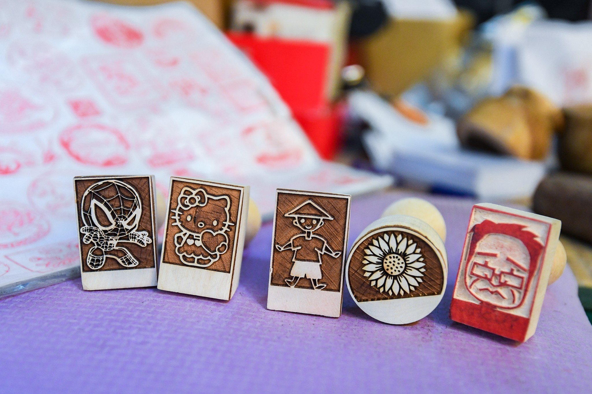 Wooden stamps are available at Pham Ngoc Toan's shop. Photo: Nam Tran / Tuoi Tre News