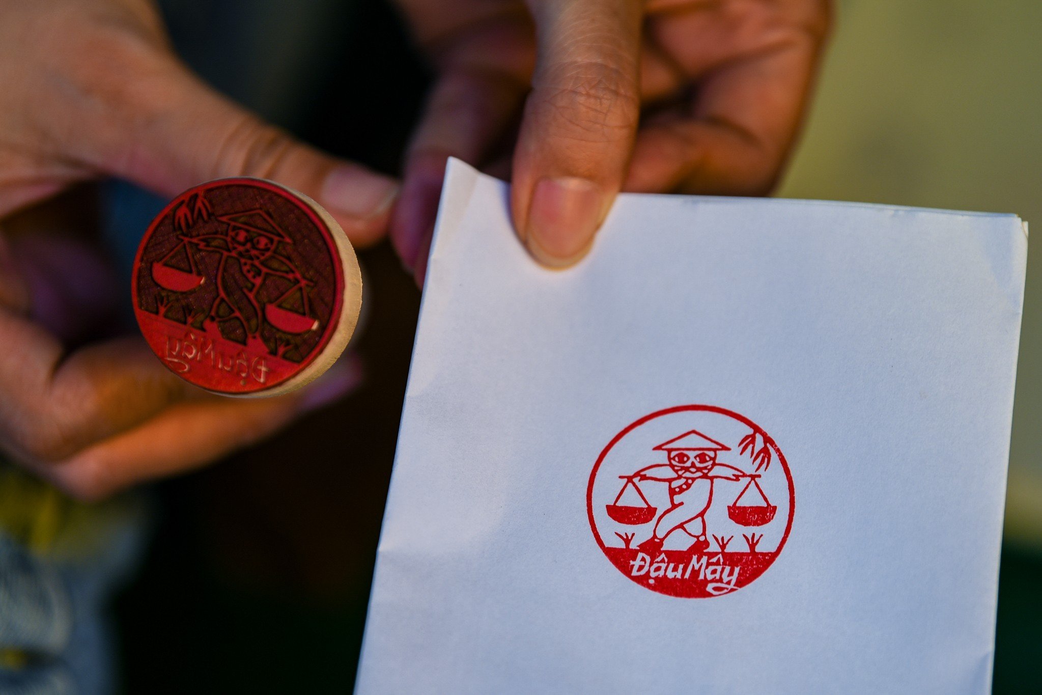 A print image is produced by a wooden stamp made by Toan. Photo: Nam Tran / Tuoi Tre News