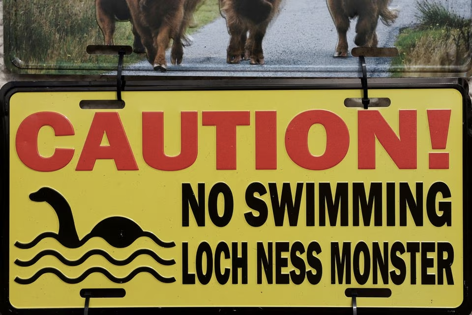 A metal sign is seen as people take part in the largest Loch Ness Monster hunt for 50 years in Scotland, Britain, August 27, 2023. Photo: Reuters