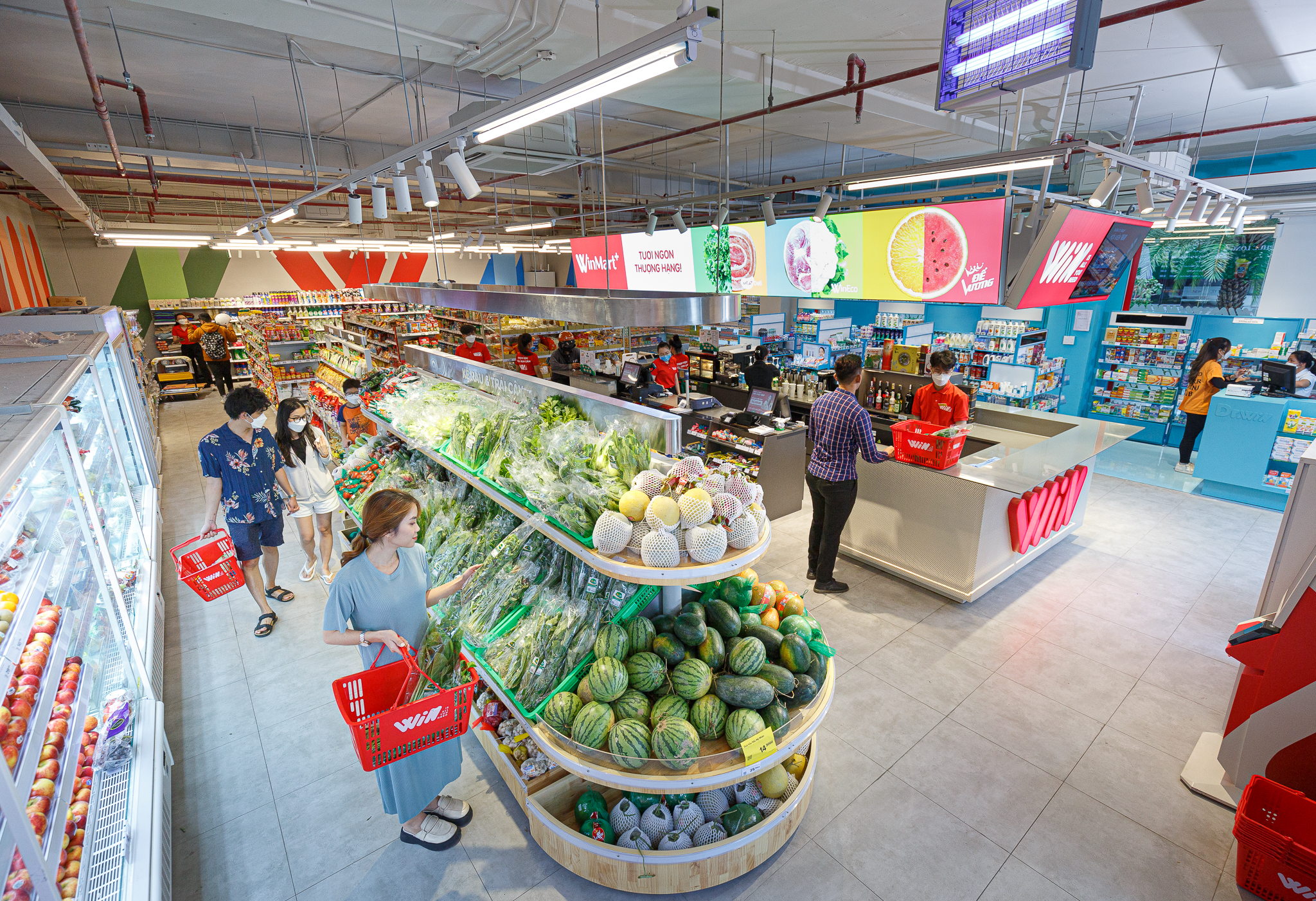 Fruits and vegetables are on shelves at a WinMart store operated by Masan.