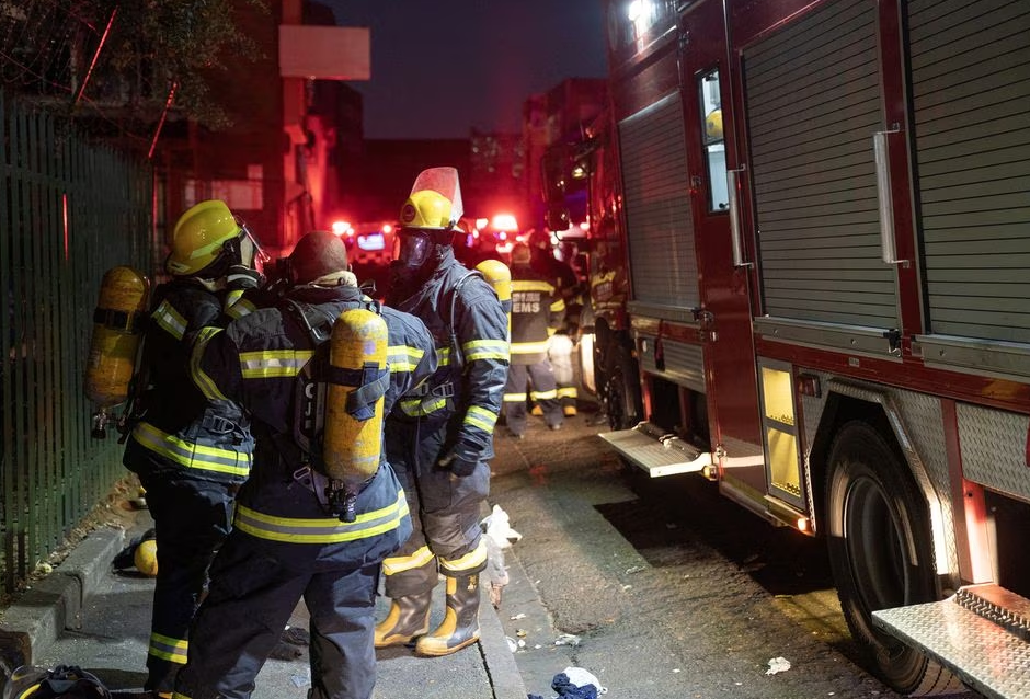 Firefighters work at the scene of a deadly blaze in the early hours of the morning, in Johannesburg, South Africa August 31, 2023. Photo: Reuters