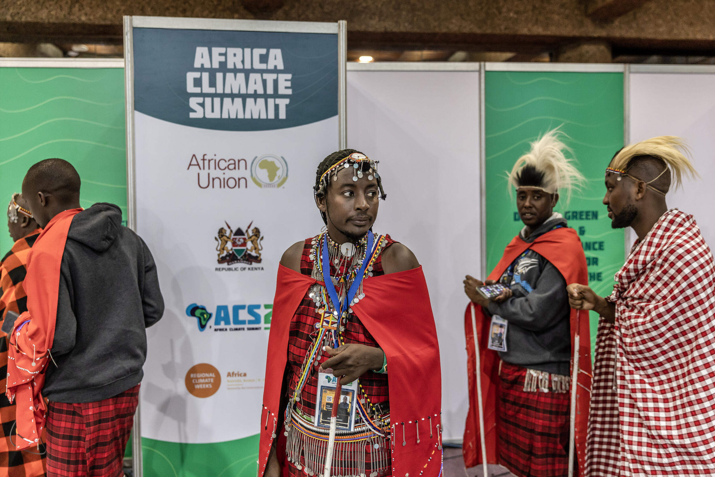 Maasai men stand while waiting for the opening session to start during the Africa Climate Summit 2023 at the Kenyatta International Convention Centre (KICC) in Nairobi on September 5, 2023. Photo: AFP