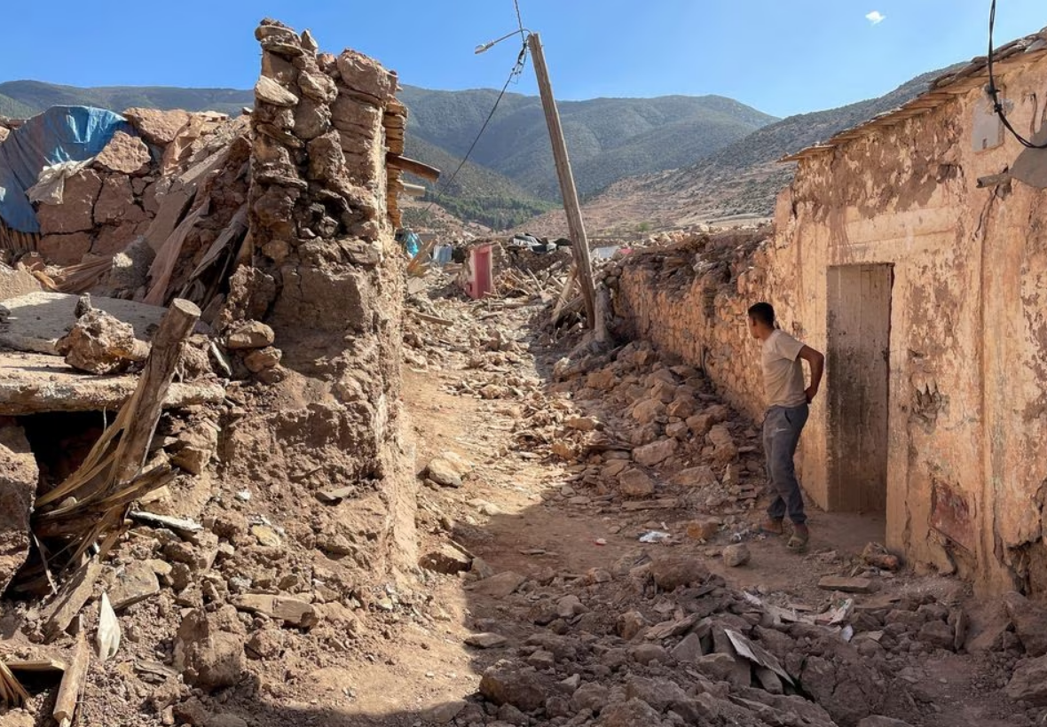 A person stands near damaged houses in Tafeghaghte, a remote village of the High Atlas mountains, following a powerful earthquake in Morocco, September 10, 2023. Photo: Reuters