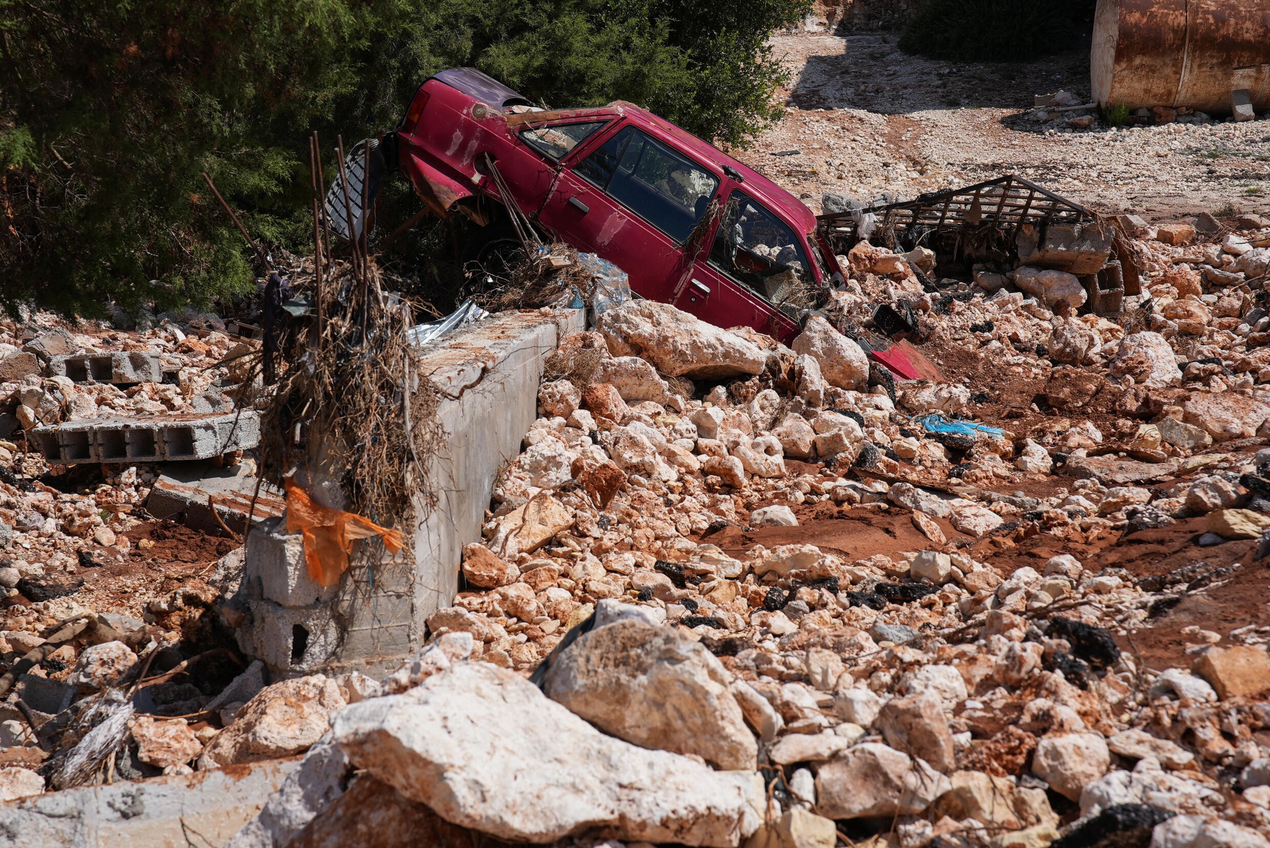 A car buried in post-flood rubble and debris in Al-Bayda in eastern Libya. Photo: AFP