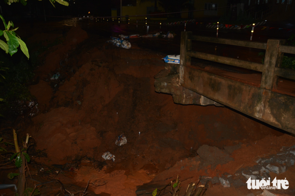 An abutment of a bridge in Tien Thanh Commune collapses after a sand slide. Photo: Tuoi Tre