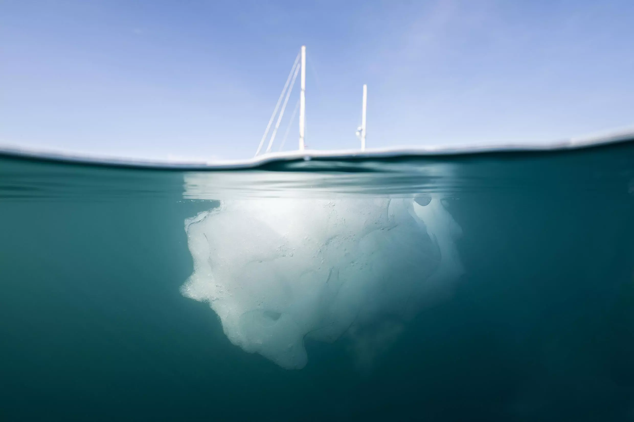 The French scientific expedition vessel 'Kamak' behind a melting iceberg in Greenland's in Scoresby Sound. Photo: AFP