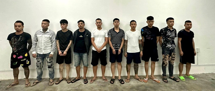 A group of suspected loan sharks are seen at a police station in Tuy Hoa City, Phu Yen Province, central Vietnam. Photo: Luong Thanh / Tuoi Tre
