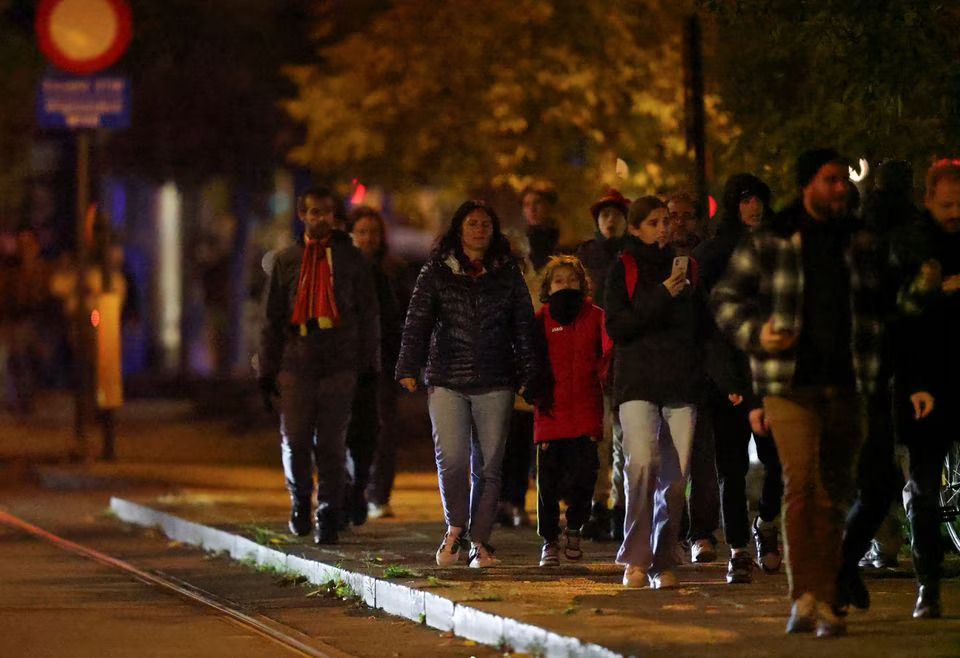 People walk outside King Baudouin Stadium after the match between Belgium and Sweden was suspended following a shooting in Brussels, Belgium, October 17, 2023. Photo: Reuters