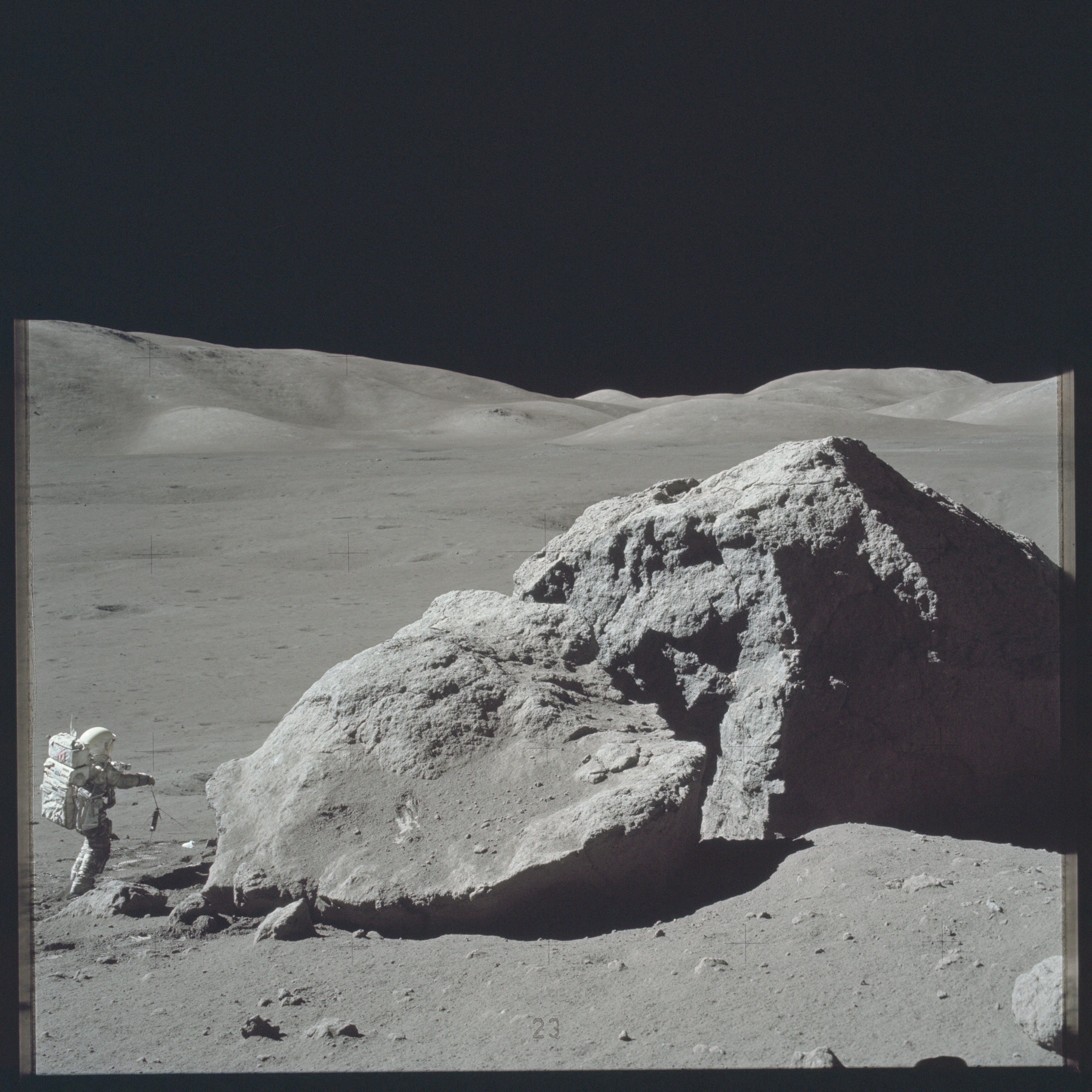 Scientist-astronaut Harrison Schmitt is photographed standing next to a huge, split boulder during the third Apollo 17 extravehicular activity (EVA) at the Taurus-Littrow landing site on the moon during the Apollo 17 mission in this December 13, 1972 NASA handout photo. Photo: Reuters